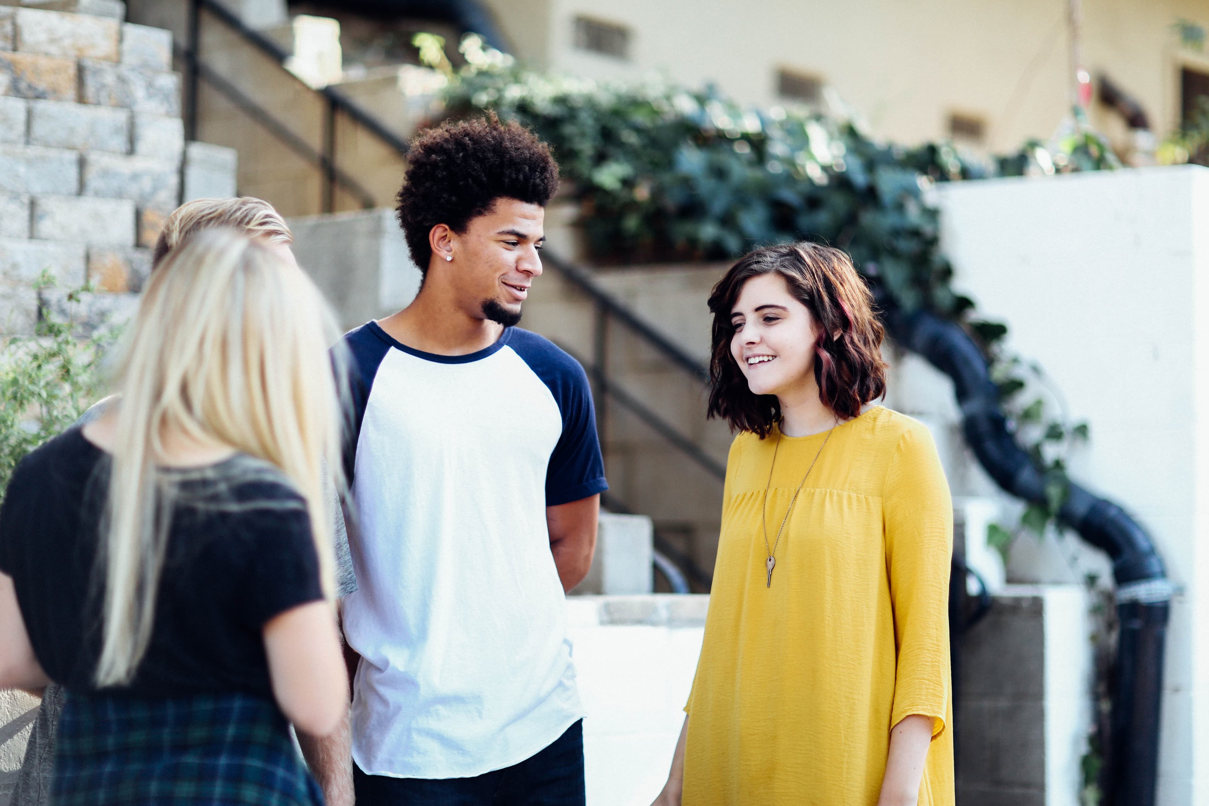 Three people meeting outside