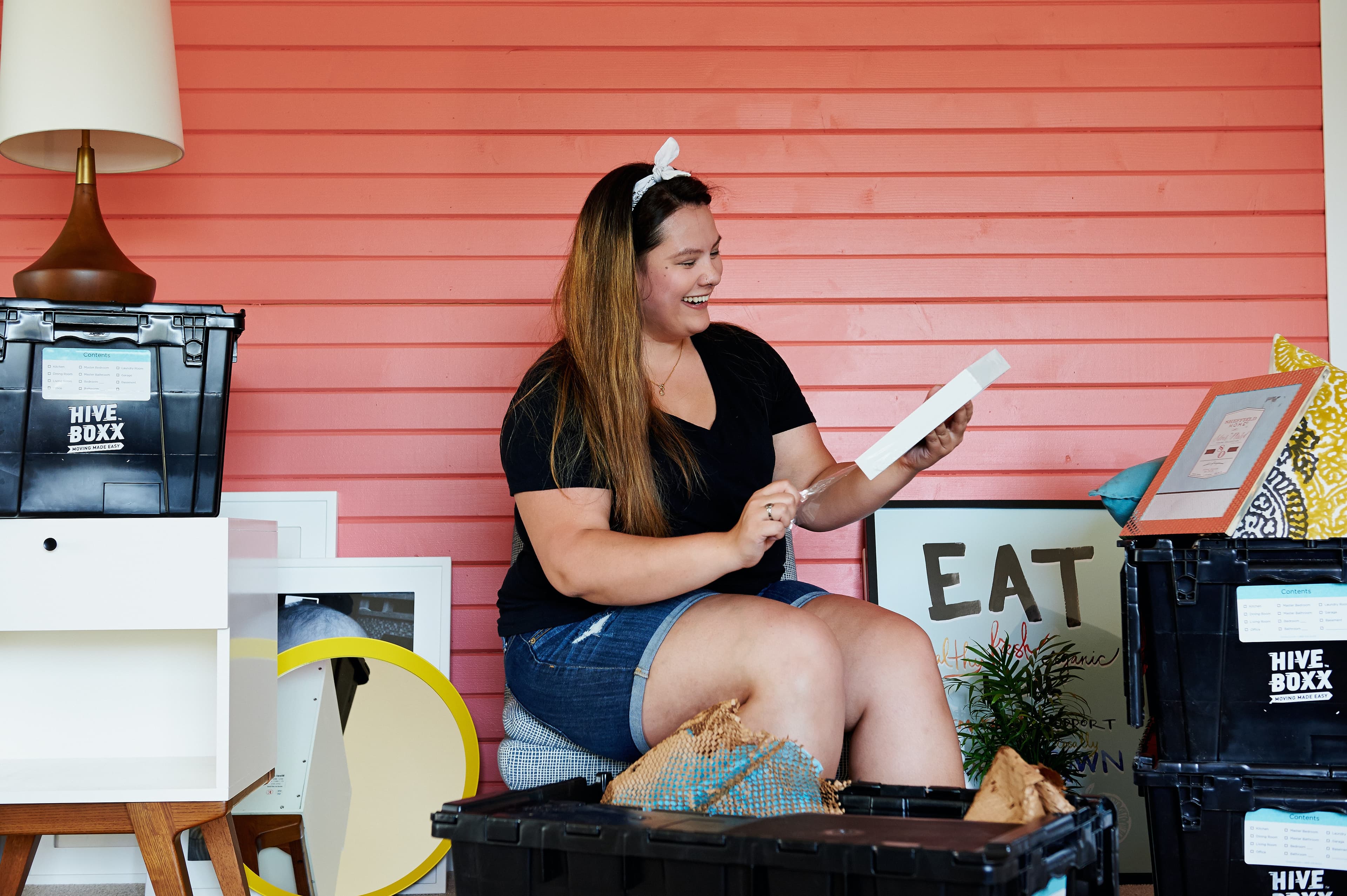 Woman setting out items for an estate sale