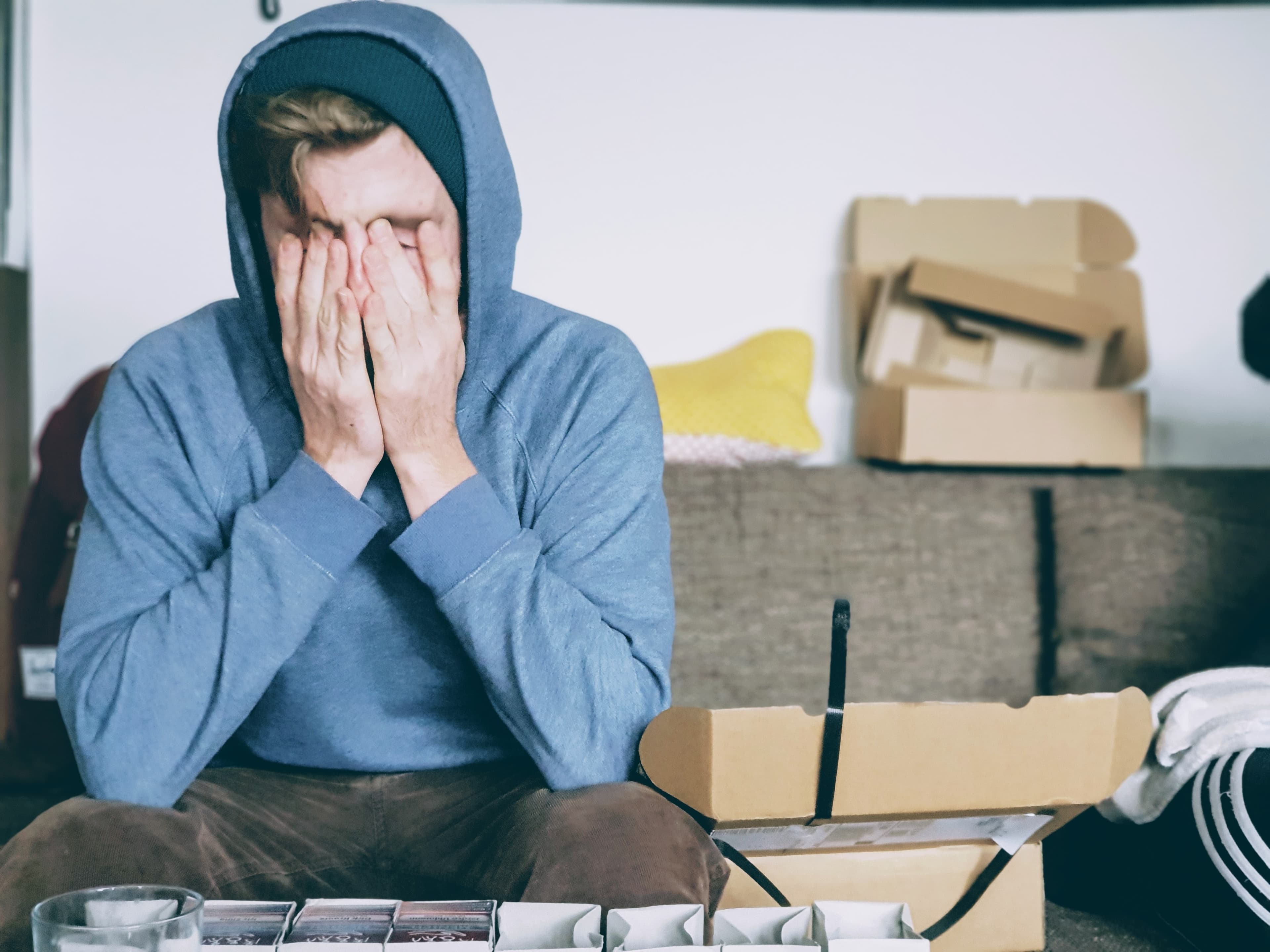 Overwhelmed man sitting on a couch